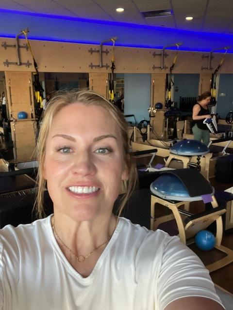 Woman selfie in Club Pilates studio